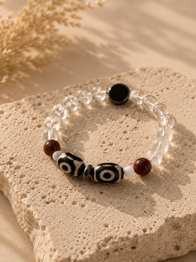 Crystal Dzi bracelet — clear quartz with Dzi beads, carnelian, and obsidian